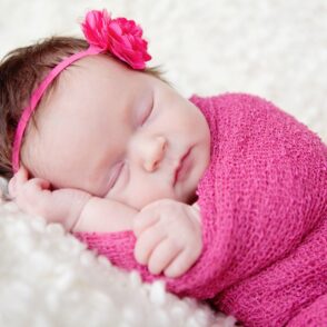 Newborn Photographer Orpington - Baby Swaddled in Pink Wrap