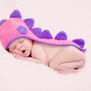 Baby wears Dinosaur Hat - Newborn Photographer Kent