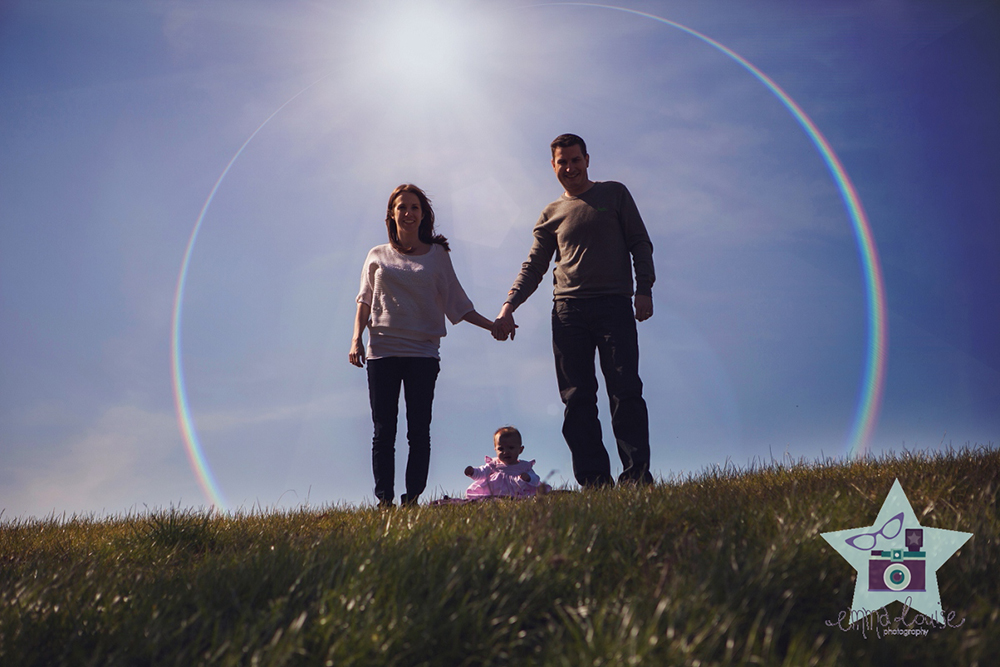 Family portrait surrounded by a rainbow - baby photography kent