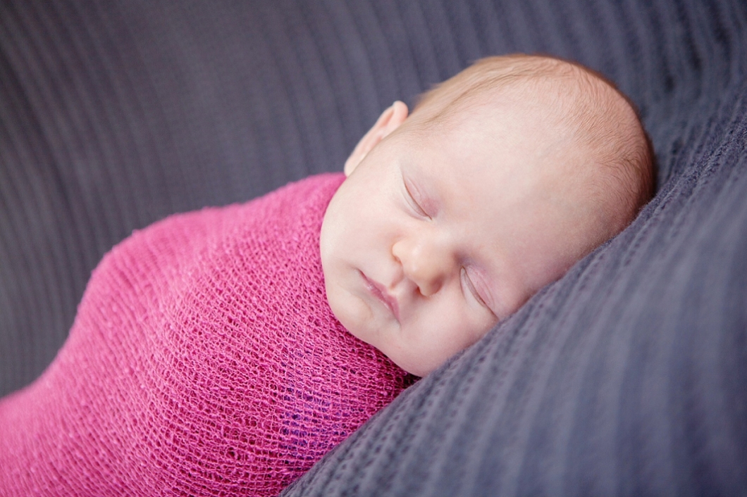 Newborn baby girl in pink wrap - baby photography Edenbridge