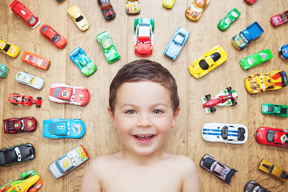 Boy poses with his cars - child photography Orpington Kent